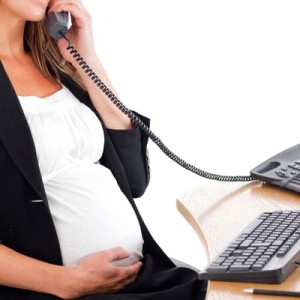 Attractive pregnant woman on the phone